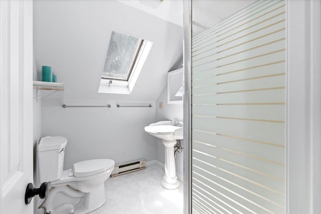 bathroom with a baseboard heating unit, a skylight, vaulted ceiling, and toilet