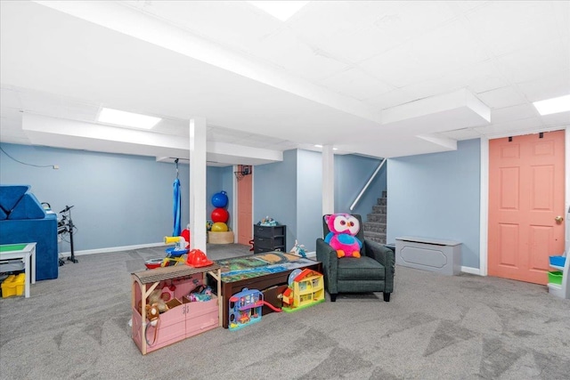 recreation room with carpet flooring and baseboards