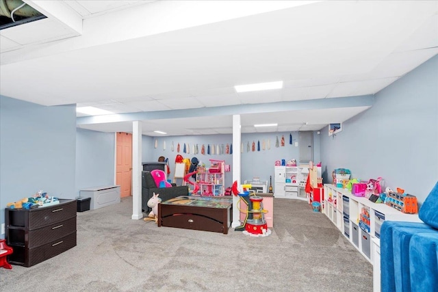 game room featuring carpet and a drop ceiling