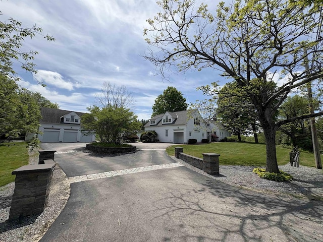 28-28A Ridge Rd, Hollis, NH 03049 - view of front of property featuring a garage, a front lawn, and driveway