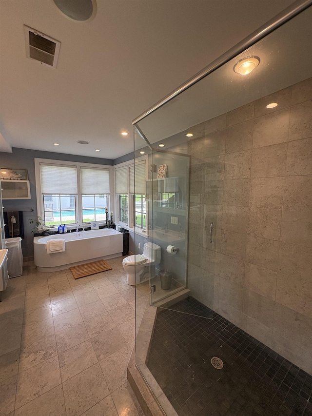 28-28A Ridge Rd, Hollis, NH 03049 - bathroom featuring a stall shower, a soaking tub, recessed lighting, and toilet