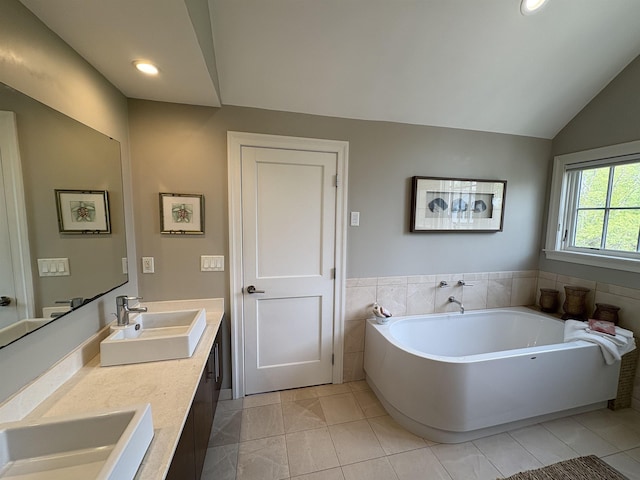 28-28A Ridge Rd, Hollis, NH 03049 - full bathroom featuring a garden tub, vaulted ceiling, double vanity, and recessed lighting