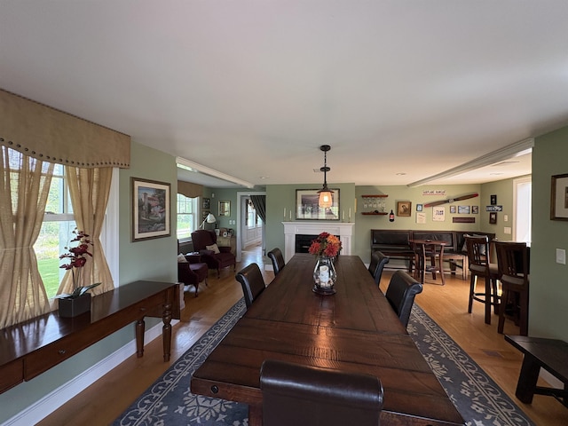 28-28A Ridge Rd, Hollis, NH 03049 - dining space featuring wood finished floors, a fireplace, and baseboards