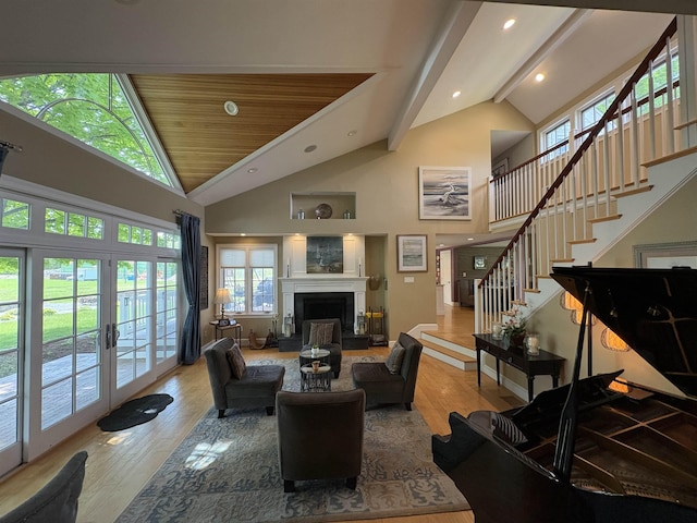 28-28A Ridge Rd, Hollis, NH 03049 - living room featuring wood finished floors, stairs, high vaulted ceiling, a fireplace with raised hearth, and recessed lighting