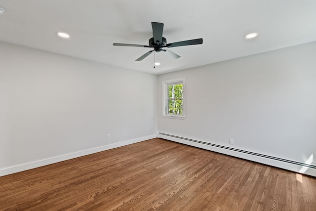 41 Elk Dr, Bedford, NH 03110 - spare room with a baseboard heating unit, wood finished floors, recessed lighting, baseboards, and a ceiling fan