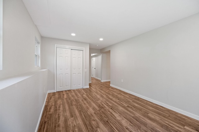 41 Elk Dr, Bedford, NH 03110 - unfurnished bedroom featuring wood finished floors, baseboards, a closet, and recessed lighting