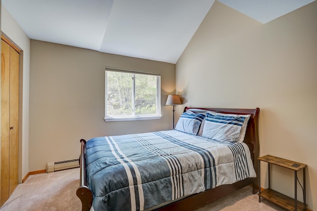 carpeted bedroom featuring a baseboard radiator, baseboards, and vaulted ceiling