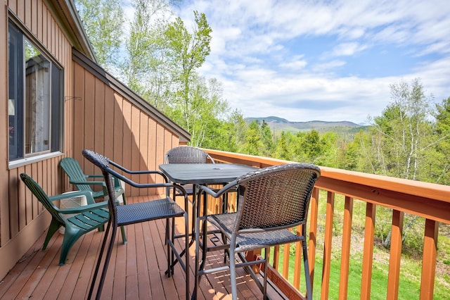 wooden deck with a mountain view