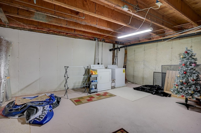 unfinished below grade area featuring washing machine and dryer