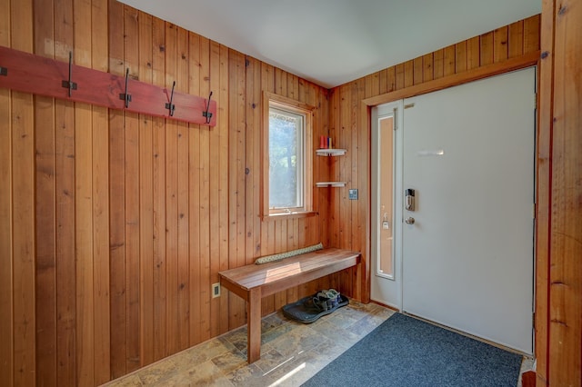 mudroom with wood walls