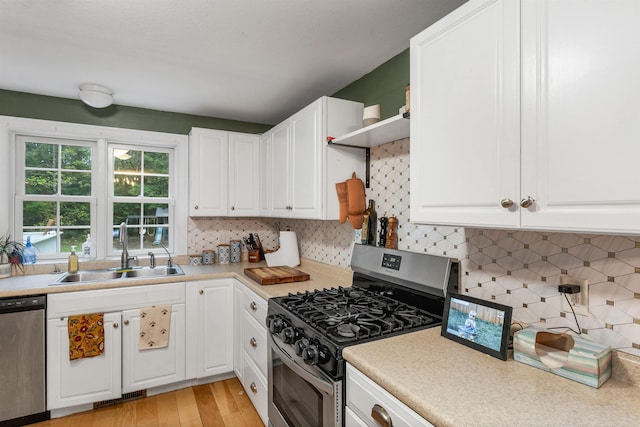 268 Lesmerises Rd, Loudon, NH 03307 - kitchen with appliances with stainless steel finishes, a sink, and white cabinetry