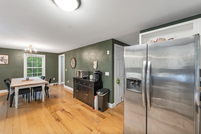 268 Lesmerises Rd, Loudon, NH 03307 - kitchen featuring stainless steel fridge, light wood-style flooring, a chandelier, and baseboards