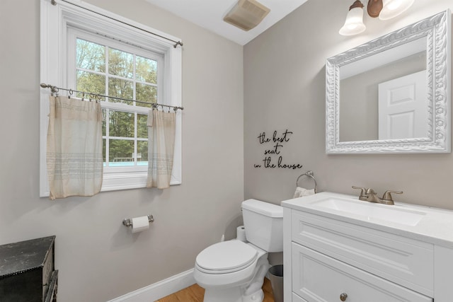 268 Lesmerises Rd, Loudon, NH 03307 - bathroom featuring vanity, toilet, and baseboards