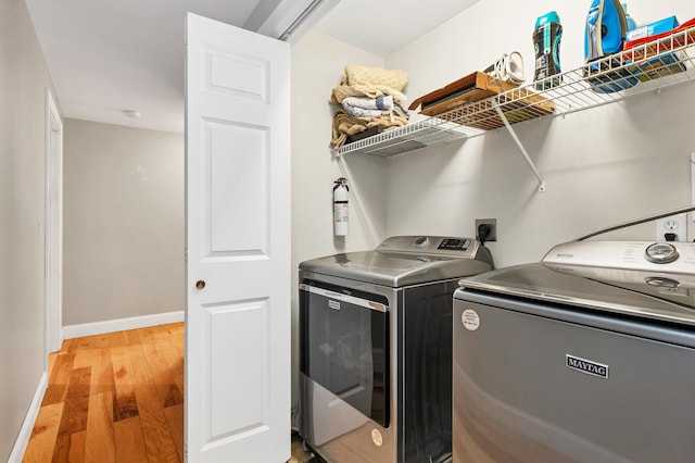 268 Lesmerises Rd, Loudon, NH 03307 - clothes washing area featuring washing machine and dryer, light wood-style flooring, and baseboards