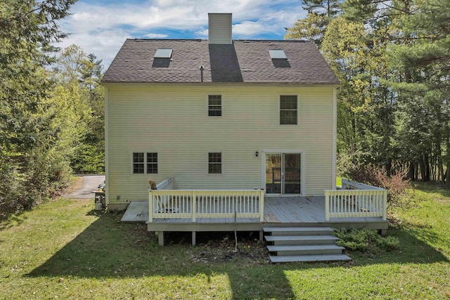 268 Lesmerises Rd, Loudon, NH 03307 - back of property featuring a yard, a chimney, and a deck