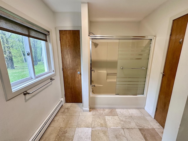 full bath with baseboard heating, combined bath / shower with glass door, and baseboards