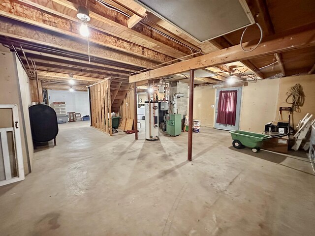 unfinished basement featuring water heater and heating fuel