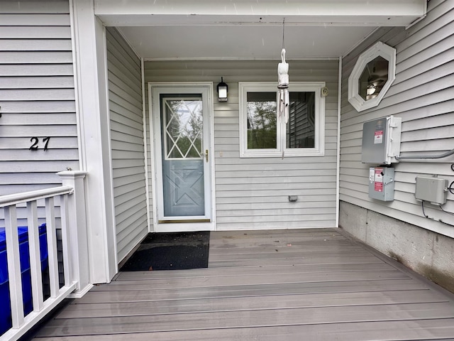 view of exterior entry with a porch
