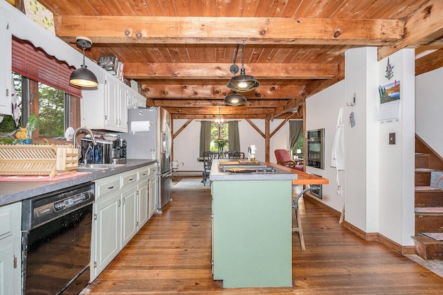 kitchen with stainless steel appliances, wood ceiling, wood finished floors, white cabinetry, and healthy amount of natural light