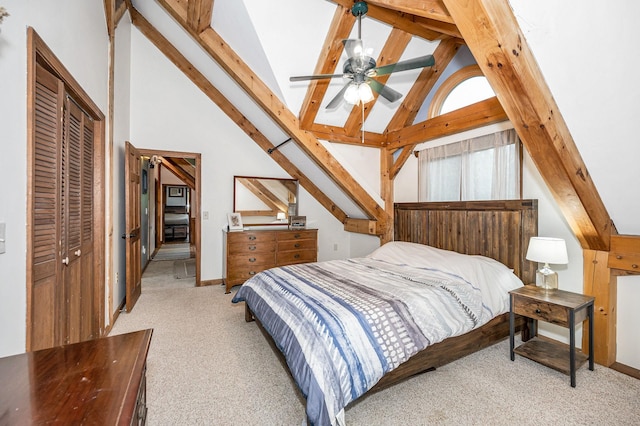 carpeted bedroom featuring a closet and baseboards