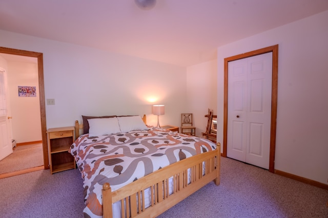 bedroom with carpet and baseboards