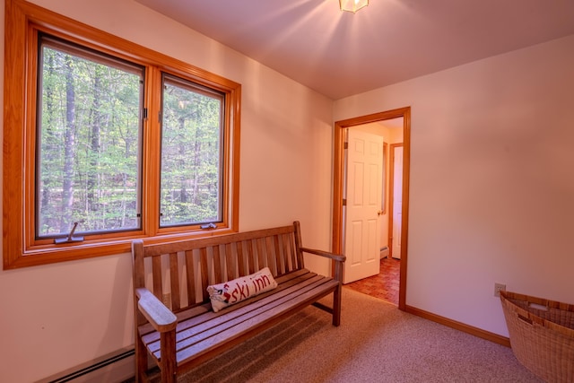 sitting room featuring carpet floors, baseboards, and baseboard heating