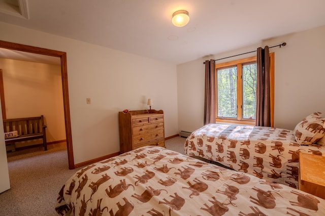 bedroom with carpet floors, a baseboard radiator, and baseboards