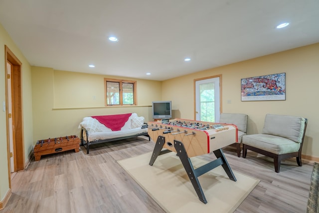 rec room featuring light wood-type flooring, healthy amount of natural light, baseboards, and recessed lighting