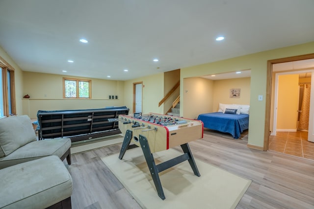 playroom with light wood-type flooring, recessed lighting, and baseboards