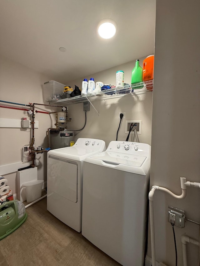 29 Bennett St, Nashua, NH 03064 - washroom featuring washer and clothes dryer, electric water heater, and wood finished floors