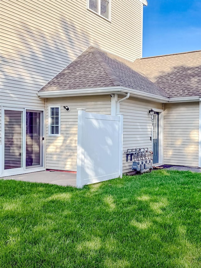 29 Bennett St, Nashua, NH 03064 - back of house with a yard and roof with shingles