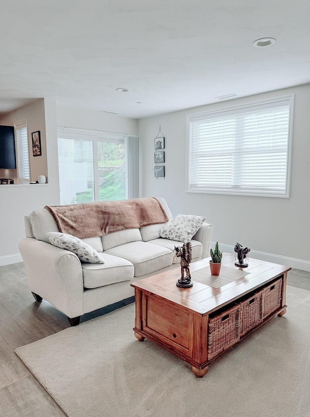 29 Bennett St, Nashua, NH 03064 - living room featuring baseboards, light wood-style floors, and recessed lighting