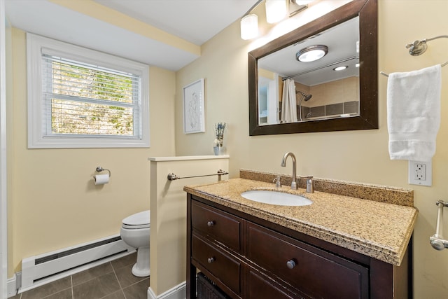 1385 Front St, Manchester, NH 03102 - full bath featuring a baseboard heating unit, toilet, tile patterned flooring, vanity, and baseboards