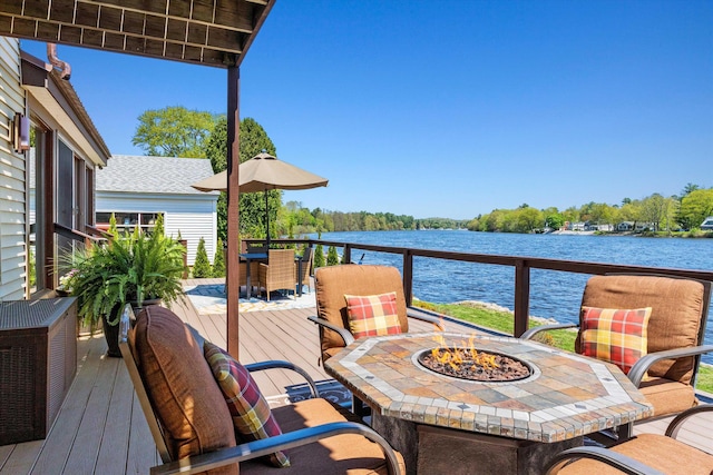 1385 Front St, Manchester, NH 03102 - wooden terrace with a fire pit, a water view, and outdoor dining space