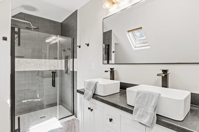 1385 Front St, Manchester, NH 03102 - full bath with a shower stall, a skylight, and double vanity