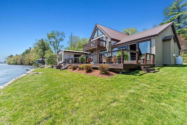 1385 Front St, Manchester, NH 03102 - view of home's exterior with a yard, a deck with water view, metal roof, and crawl space