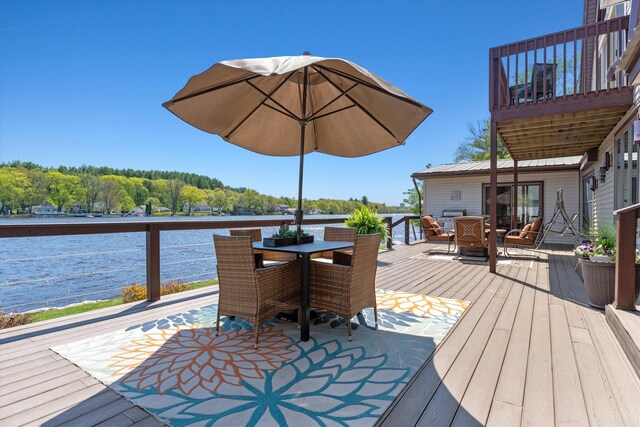 1385 Front St, Manchester, NH 03102 - wooden deck featuring outdoor dining area and a water view