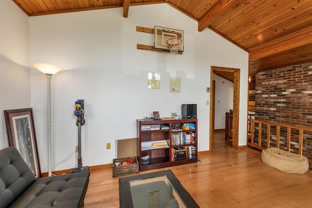 living room featuring wood ceiling, wood finished floors, and baseboards