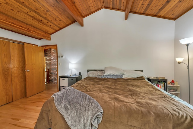 bedroom with light wood-type flooring and wooden ceiling