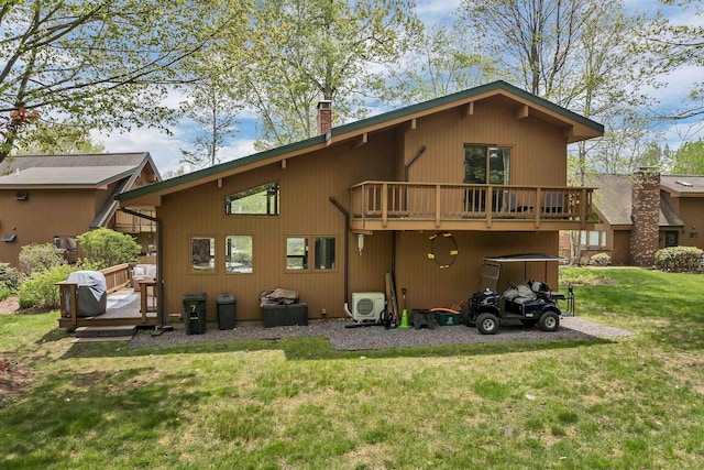 back of house with a wooden deck, a lawn, a chimney, and ac unit