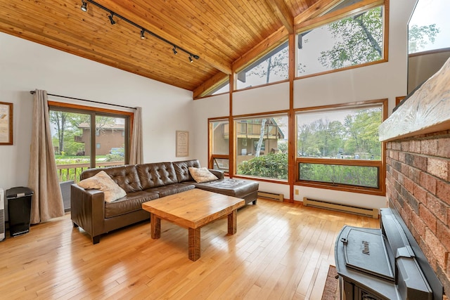 living room featuring track lighting, a baseboard radiator, wood ceiling, high vaulted ceiling, and light wood-style floors