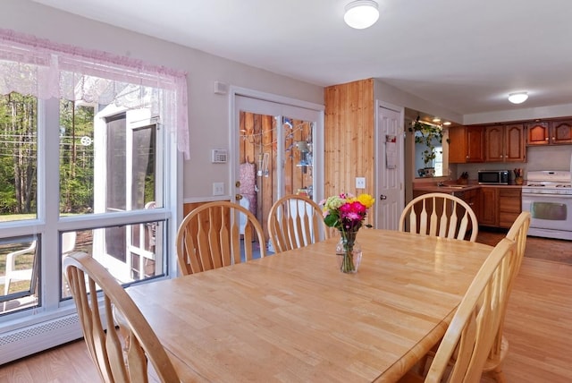dining space featuring light wood-type flooring