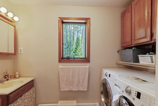 washroom with separate washer and dryer and cabinet space