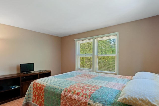 bedroom featuring light wood-style flooring