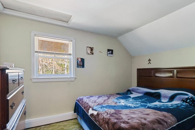 bedroom with vaulted ceiling, carpet flooring, attic access, and baseboards