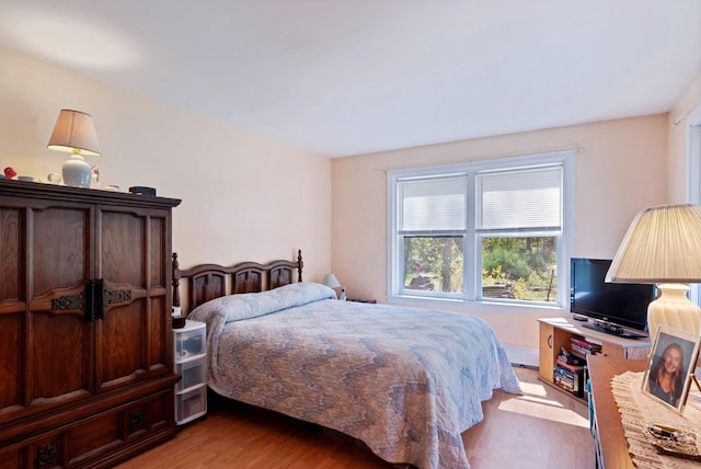 bedroom with light wood-style floors