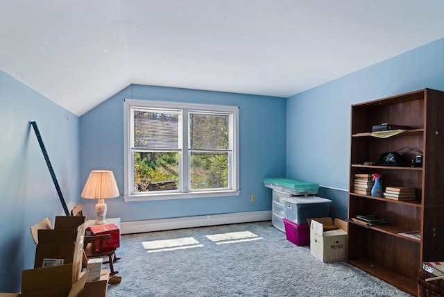 living area with baseboard heating, lofted ceiling, carpet, and baseboards