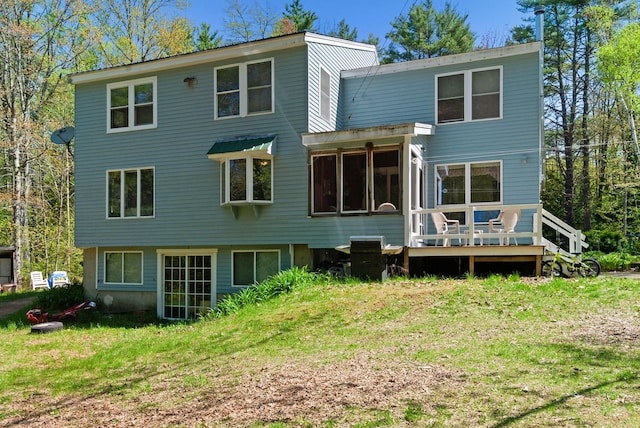 back of house with a yard and a deck