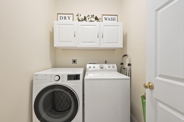 laundry room with cabinet space and independent washer and dryer