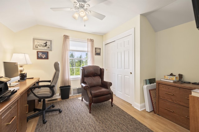 office featuring lofted ceiling, ceiling fan, light wood-type flooring, and baseboards